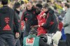 Bayern's Alphonso Davies, center, leaves the field after getting injured during the German Bundesliga soccer match between Borussia Dortmund and Bayern Munich in Dortmund, Germany, Saturday, Oct. 8, 2022. (AP Photo/Martin Meissner)