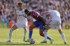 Crystal Palace's Jordan Ayew in action with Leeds United's Rodrigo Moreno, left, and Marc Roca during the English Premier League soccer match between Crystal Palace and Leeds United at Selhurst Park, London, Sunday Oct. 9, 2022. (Steven Paston/PA via AP)