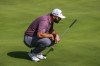 Jon Rahm, of Spain, looks over his line on the 4th hole during the Spanish Open golf tournament at Club de Campo Villa in Madrid, Spain, Sunday, Oct. 9, 2022. (AP Photo/Manu Fernandez)