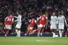 Arsenal's Bukayo Saka, third from left, celebrates after scoring his side's third goal during the English Premier League soccer match between Arsenal and Liverpool at Emirates Stadium in London, Sunday, Oct. 9, 2022. (AP Photo/Rui Vieira)