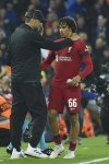 Liverpool's manager Jurgen Klopp, left, talks with Liverpool's Trent Alexander-Arnold after substitution during the Champions League Group A soccer match between Liverpool and Rangers at Anfield stadium in Liverpool, England, Tuesday Oct. 4, 2022. (AP Photo/Rui Vieira)