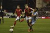 Nottingham Forest's Ryan Yates, centre, holds off Aston Villa's Ollie Watkins during the English Premier League soccer match between Nottingham Forest and Aston Villa at the City ground in Nottingham, England, Monday, Oct.10, 2022. (AP Photo/Rui Vieira)
