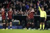 Referee Artur Soares Dias gives a red card to Manchester City's Sergio Gomez, far left, during the group G, Champions League soccer match between FC Copenhagen and Manchester City, at Parken Stadium in Copenhagen, Denmark, Tuesday Oct. 11, 2022. (Liselotte Sabroe/Ritzau Scanpix via AP)