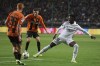 Real Madrid's Vinicius Junior, right, challenges for the ball with Shakhtar's Yukhym Konoplya, left, and Shakhtar's Artem Bondarenko during the Champions League group F soccer match between Shakhtar Donetsk and Real Madrid at Polish Army Stadium stadium in Warsaw, Poland, Tuesday, Oct. 11, 2022. (AP Photo/Michal Dyjuk)