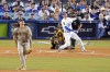 Los Angeles Dodgers' Trea Turner, right, hits a solo home run as San Diego Padres starting pitcher Mike Clevinger, left, and catcher Austin Nola watch during the first inning in Game 1 of a baseball NL Division Series Tuesday, Oct. 11, 2022, in Los Angeles. (AP Photo/Marcio Jose Sanchez)