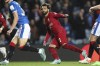 Liverpool's Mohamed Salah, centre, celebrates after scoring his side's sixth goal during the Champions League Group A soccer match between Rangers and Liverpool at Ibrox stadium in Glasgow, Scotland, Wednesday, Oct. 12, 2022. (AP Photo/Scott Heppell)
