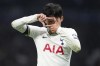 Tottenham's Son Heung-min, left, celebrates scoring his side's third goal during the Champions League Group D soccer match between Tottenham Hotspur and Eintracht Frankfurt at Tottenham Hotspur stadium in London, Wednesday, Oct.12, 2022. (Zac Goodwin/PA via AP)