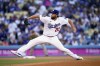 Los Angeles Dodgers starting pitcher Clayton Kershaw throws to a San Diego Padres batter during the first inning in Game 2 of a baseball NL Division Series, Wednesday, Oct. 12, 2022, in Los Angeles. (AP Photo/Ashley Landis)