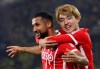 Freiburg's Daniel-Kofi Kyerehv, left, celebrates scoring with teammate Ritsu Doan during the Europa League soccer match between SC Freiburg and FC Nantes at Europa-Park Stadion, Freiburg, Germany, Thursday Oct. 6, 2022. (Marijan Murat/dpa via AP)