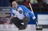 Team Quebec skip Jean-Michel Menard watches his shot approach the house during round robin competition against Team Alberta at the Brier curling championship Wednesday March 9, 2016 in Ottawa. THE CANADIAN PRESS/Adrian Wyld