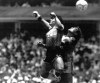 FILE - Argentina's Diego Maradona, left, beats England goalkeeper Peter Shilton to a high ball and scores his first of two goals in a World Cup quarterfinal soccer match, in Mexico City, on June 22, 1986. The ball used when Maradona scored his “Hand of God” goal against England at the 1986 World Cup has been put up for auction by the Tunisian referee who was in charge of the game. Graham Budd Auctions said Thursday Oct. 13, 2022 that they expect the 36-year-old Adidas ball, which referee Ali Bin Nasser owns, to fetch between $2.7 million and $3.3 million when it goes up for sale in Britain on Nov. 16, four days before the World Cup in Qatar kicks off. (AP Photo/El Grafico, File)