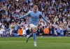 Manchester City's Phil Foden celebrates scoring his side's fourth goal during the English Premier League soccer match between Manchester City and Manchester United at Etihad stadium in Manchester, England, Sunday, Oct. 2, 2022. (Martin Rickett/PA via AP)