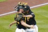 Pittsburgh Pirates relief pitcher Yohan Ramirez, right, embraces catcher Tyler Heineman after the team's 5-3 win over the St. Louis Cardinals in a baseball game Wednesday, Oct. 5, 2022, in Pittsburgh. (AP Photo/Keith Srakocic)