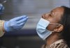 A health-care worker tests a woman at a pop-up COVID-19 assessment centre at the Angela James Arena during the COVID-19 pandemic in Toronto May 19, 2021. THE CANADIAN PRESS/Nathan Denette