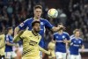 Schalke's Marius Bulter and Hoffenheim's Georginio Rutter, front, battle for the ball during the Bundesliga soccer match between FC Schalke 04 and TSG 1899 Hoffenheim at Veltins Arena, Gelsenkirchen, Germany, Friday Oct. 14, 2022. (Bernd Thissen/dpa via AP)