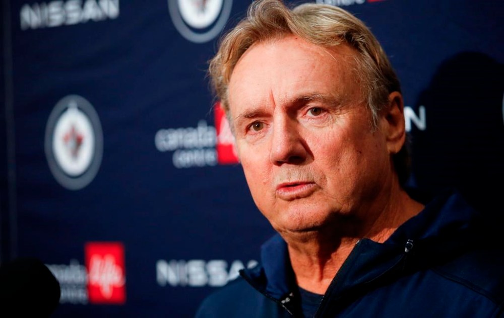 Winnipeg Jets new head coach Rick Bowness speaks to media during opening day of their NHL training camp practice in Winnipeg on September 22, 2022. Rick Bowness will have to wait a little longer to make his regular-season debut with the Winnipeg Jets. The team announced a few hours before Friday's season opener against the New York Rangers the 67-year-old had tested positive for COVID-19. THE CANADIAN PRESS/John Woods