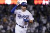 Los Angeles Dodgers' Trea Turner celebrates as he runs the bases on a solo home run against the San Diego Padres during the third inning in Game 2 of a baseball NL Division Series, Wednesday, Oct. 12, 2022, in Los Angeles. (AP Photo/Mark J. Terrill)
