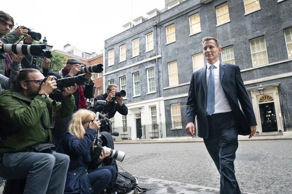 Jeremy Hunt leaves 10 Downing Street in London after he was appointed Chancellor of the Exchequer following the resignation of Kwasi Kwarteng, Friday Oct. 14, 2022. Chancellor of the Exchequer Kwasi Kwarteng said he has accepted Prime Minister Liz Truss' request he