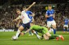 Everton's goalkeeper Jordan Pickford dives for a save but ends up bringing down Tottenham's Harry Kane, left, and giving away a penalty during the English Premier League soccer match between Tottenham Hotspur and Everton at the Tottenham Hotspur Stadium in London, England, Saturday, Oct. 15, 2022. (AP Photo/Kin Cheung)