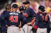 Trainers speaks with Atlanta Braves starting pitcher Charlie Morton (50) after he was hit by a ball during the second inning in Game 4 of baseball's National League Division Series between the Philadelphia Phillies and the Atlanta Braves, Saturday, Oct. 15, 2022, in Philadelphia. (AP Photo/Matt Slocum)
