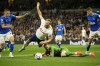 Everton's goalkeeper Jordan Pickford dives for a save but ends up bringing down Tottenham's Harry Kane, center, and giving away a penalty during the English Premier League soccer match between Tottenham Hotspur and Everton at the Tottenham Hotspur Stadium in London, England, Saturday, Oct. 15, 2022. (AP Photo/Kin Cheung)