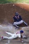 Philadelphia Phillies catcher J.T. Realmuto (10) slides into home for a home run during the third inning in Game 4 of baseball's National League Division Series between the Philadelphia Phillies and the Atlanta Braves, Saturday, Oct. 15, 2022, in Philadelphia. (AP Photo/Matt Slocum)