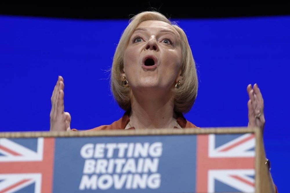 FILE - Britain's Prime Minister Liz Truss makes a speech at the Conservative Party conference at the ICC in Birmingham, England, Wednesday, Oct. 5, 2022. Truss has only been in office for six weeks. But already her libertarian economic policies have triggered a financial crisis, emergency central bank intervention, multiple U-turns and the firing of her Treasury chief. (AP Photo/Kirsty Wigglesworth, File)