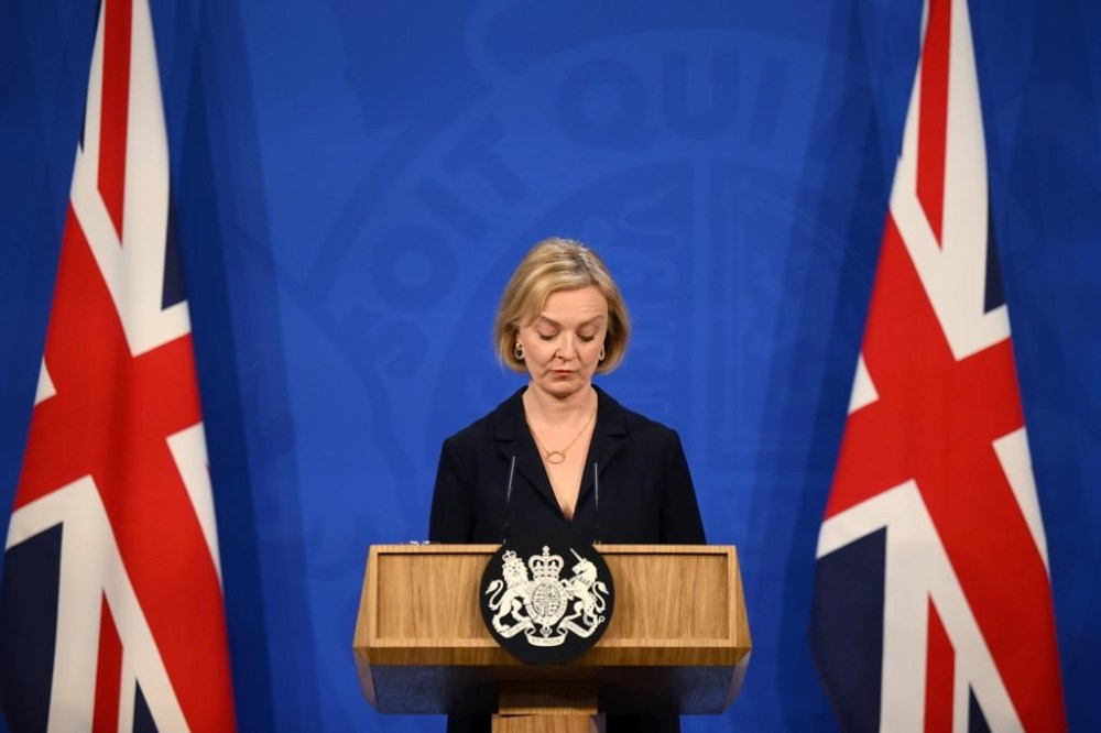 FILE - Britain's Prime Minister Liz Truss attends a press conference in the Downing Street Briefing Room in central London, Friday Oct. 14, 2022. Truss has only been in office for six weeks. But already her libertarian economic policies have triggered a financial crisis, emergency central bank intervention, multiple U-turns and the firing of her Treasury chief. (Daniel Leal/Pool Photo via AP, File)