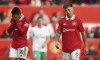 Manchester United's Casemiro, left, and Manchester United's Lisandro Martinez reacts disappointed after the English Premier League soccer match between Manchester United and Newcastle at Old Trafford stadium in Manchester, England, Sunday, Oct. 16, 2022. (AP Photo/Dave Thompson)
