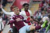 CAPTION CORRECTION - CORRECTS ID OF WEST HAM PLAYER - West Ham's Jarrod Bowen, left, vies for the ball with Southampton's Mohammed Salisu during the English Premier League soccer match between Southampton and West Ham United and at St Mary's Stadium in Southampton, England, Sunday, Oct. 16, 2022. (AP Photo/Kin Cheung)