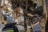 Firefighters work after a drone fired on buildings in Kyiv, Ukraine, Monday, Oct. 17, 2022. Waves of explosive-laden suicide drones struck Ukraine's capital as families were preparing to start their week early Monday, the blasts echoing across Kyiv, setting buildings ablaze and sending people scurrying to shelters. (AP Photo/Roman Hrytsyna)