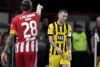 Dortmund's Marco Reus, right, reacts as Union's Christopher Trimmel, left points up during the German Bundesliga soccer match between 1. FC Union Berlin and Borussia Dortmund in Berlin, Germany, Sunday, Oct. 16, 2022. (AP Photo/Michael Sohn)