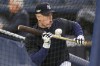 New York Yankees' Harrison Bader bunts during batting practice before Game 5 of an American League Division baseball series against the Cleveland Guardians, Monday, Oct. 17, 2022, in New York. (AP Photo/Seth Wenig)