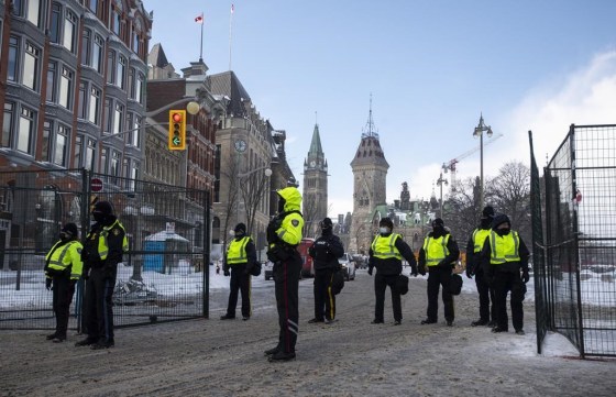 Police restrict access to the streets around Parliament Hill in Ottawa in February. (Justin Tang / The Canadian Press files)