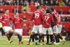 Manchester United players argue with referee Craig Pawson during the English Premier League soccer match between Manchester United and Newcastle at Old Trafford stadium in Manchester, England, Sunday, Oct. 16, 2022. (AP Photo/Dave Thompson)