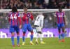 Crystal Palace's Wilfried Zaha, second left, celebrates at the end of the English Premier League soccer match between Crystal Palace and Wolverhampton Wanderers at Selhurst Park, in London, Tuesday, Oct. 18, 2022. (Zac Goodwin/PA via AP)