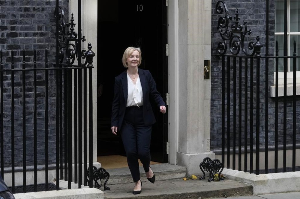 Britain's Prime Minister Liz Truss leaves 10 Downing Street to attend the weekly Prime Ministers' Questions session in parliament in London, Wednesday, Oct. 19, 2022. (AP Photo/Kin Cheung)