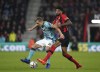 Southampton's James Ward-Prowse, left, and Bournemouth's Philip Billing battle for the ball during the English Premier League soccer match at the Vitality Stadium, Bournemouth, England, Wednesday Oct. 19, 2022. (Adam Davy/PA via AP)
