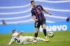 Real Madrid's Dani Carvajal tries to tackle Barcelona's Robert Lewandowski during a Spanish La Liga soccer match between Real Madrid and Barcelona at the Santiago Bernabeu stadium in Madrid, Sunday, Oct. 16, 2022. (AP Photo/Manu Fernandez)
