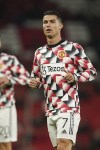 Manchester United's Cristiano Ronaldo warms up prior the start of a group E Europa League soccer match between Manchester United and Omonia at Old Trafford stadium in Manchester, England, Thursday, Oct. 13, 2022. (AP Photo/Dave Thompson)