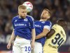 Schalke's Florent Mollet, left, and Simon Terodde battle for the ball with Hoffenheim's Stanley N'Soki during the Bundesliga soccer match between FC Schalke 04 and TSG 1899 Hoffenheim at Veltins Arena, Gelsenkirchen, Germany, Friday Oct. 14, 2022. (Bernd Thissen/dpa via AP)