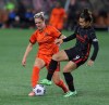 Portland Thorns forward Sophia Smith, right, and Houston Dash midfielder Sophie Schmidt, left, compete for the ball during the second half of an NWSL soccer match in Portland, Ore., Wednesday, Oct. 6, 2021. The Houston Dash have signed Canadian internationals Sophie Schmidt and Allysha Chapman to contract extensions. THE CANADIAN PRESS/AP/Steve Dipaola
