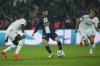 PSG's Lionel Messi, centre, challenges for the ball with Marseille's Eric Bailly, left, and Matteo Guendouzi during the French League One soccer match between Paris Saint-Germain and Marseille at the Parc des Princes in Paris, Sunday, Oct. 16, 2022. (AP Photo/Thibault Camus)