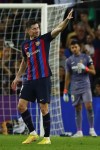 Barcelona's Robert Lewandowski celebrates after scoring his side's second goal during the Spanish La Liga soccer match between FC Barcelona and Villareal at Camp Nou stadium in Barcelona, Spain, Thursday, Oct. 20, 2022. (AP Photo/Joan Monfort)