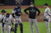 New York Yankees manager Aaron Boone blows a bubble whilst making a pitching change during the eighth inning in Game 2 of baseball's American League Championship Series between the Houston Astros and the New York Yankees, Thursday, Oct. 20, 2022, in Houston. (AP Photo/Sue Ogrocki )
