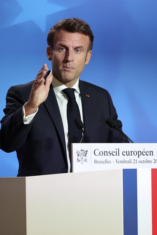 French President Emmanuel Macron speaks during a media conference at an EU summit in Brussels, Friday, Oct. 21, 2022. European Union leaders gathered Friday to take stock of their support for Ukraine after President Volodymyr Zelenskyy warned that Russia is trying to spark a refugee exodus by destroying his war-ravaged country's energy infrastructure. (AP Photo/Olivier Matthys)