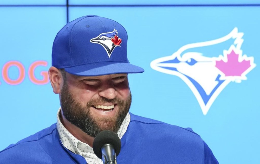 Toronto Blue Jays manager John Schneider smiles after being announced a three-year contract to remain as the team's manager during a press conference in Toronto on Friday, Oct. 21, 2022. THE CANADIAN PRESS/Nathan Denette