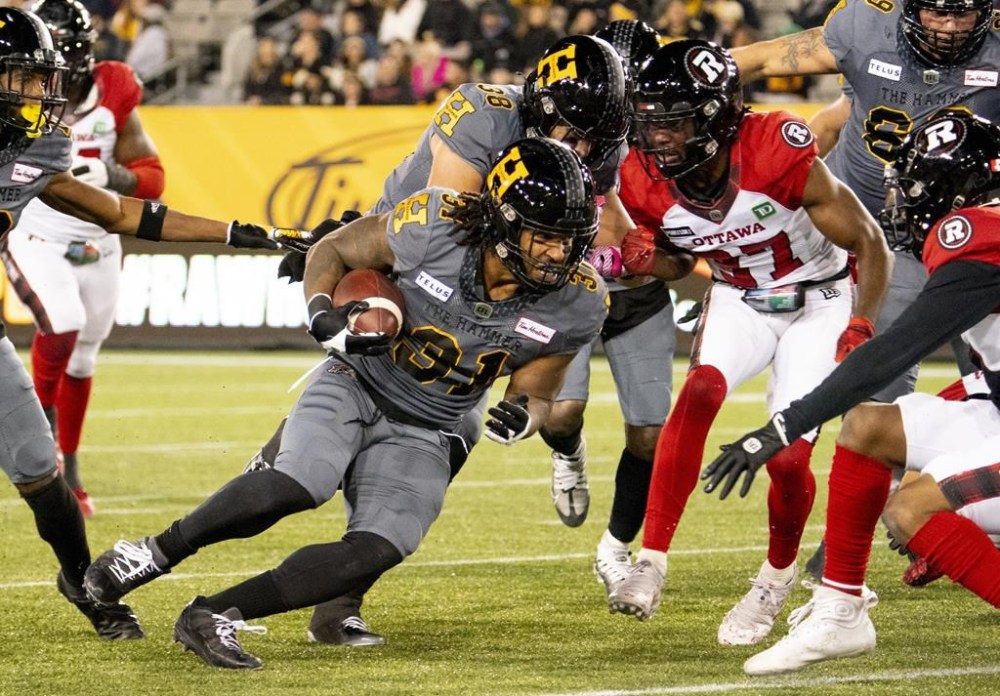 Hamilton Tiger-Cats running back Sean Thomas Erlington (31) carries the ball during first half CFL football game action against the Ottawa Redblacks in Hamilton, Ont. on Friday, October 21, 2022. THE CANADIAN PRESS/Peter Power