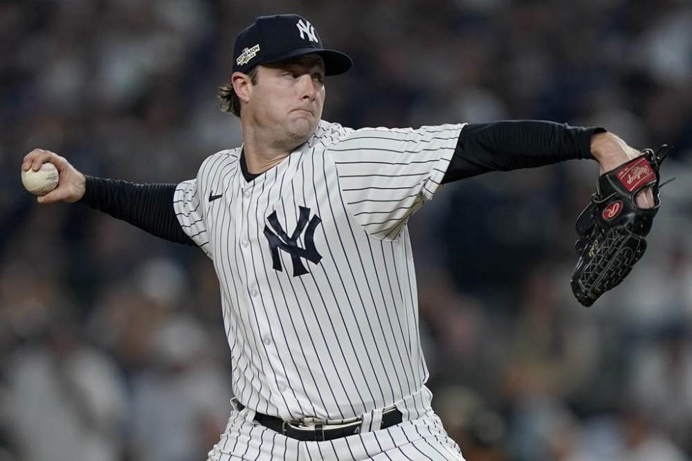 New York Yankees starting pitcher Gerrit Cole delivers against the Cleveland Guardians during the first inning of Game 1 of an American League Division baseball series, Tuesday, Oct. 11, 2022, in New York. (AP Photo/John Minchillo)