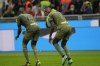 AC Milan's Rafael Leao celebrates with his teammate Fikayo Tomori after scoring his side's fourth goal during a Serie A soccer match between AC Milan and Monza, at the San Siro stadium in Milan, Italy, Saturday, Oct. 22, 2022. (AP Photo/Luca Bruno)